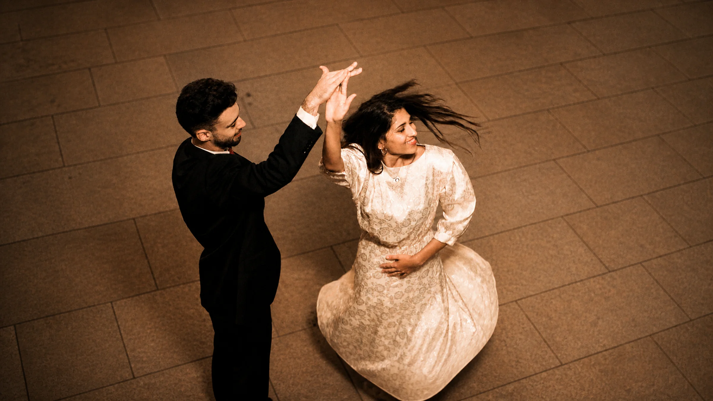 A couple dancing together at an elegant evening event